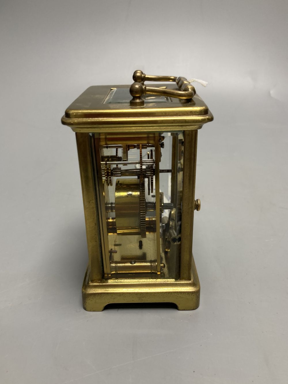 A gilt-brass carriage timepiece, with white enamelled Roman dial and outer travelling case and another carriage clock (2)